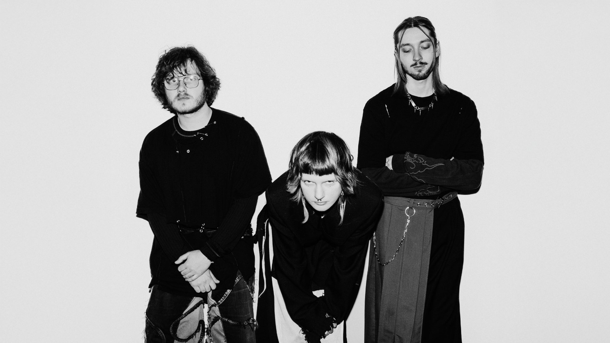 Meowlau, black-and-white photograph of the three band members